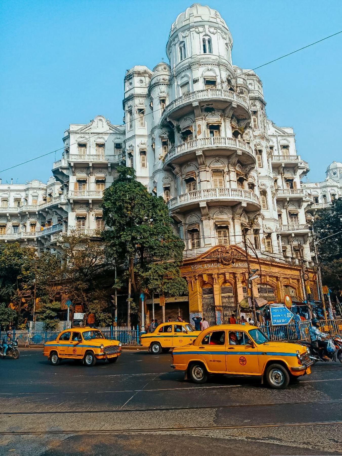 Yellow taxis outside a colonial-era building in central Kolkata